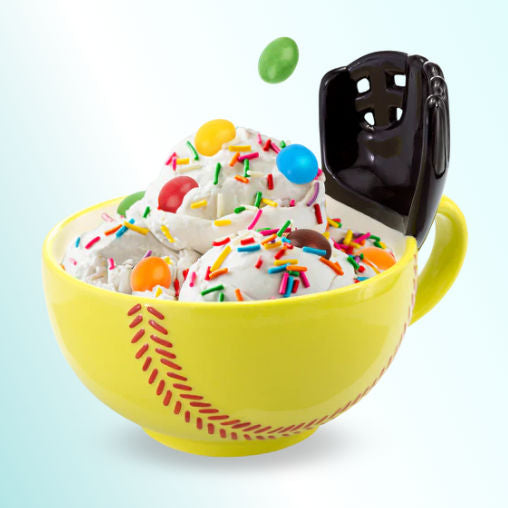 Yellow softball mug with a glove ice cream bowl with colorful sprinkles and a black scoop on a light blue background