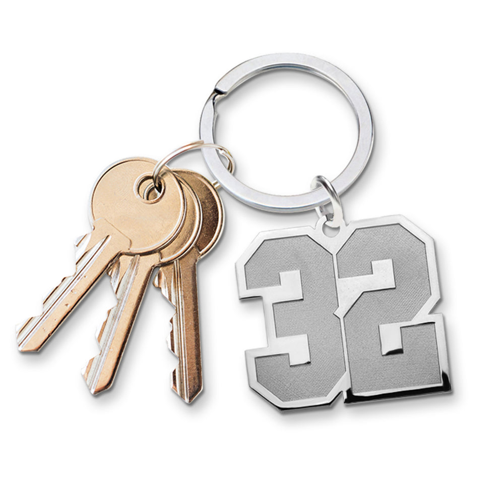 Custom sports number keychain with number '32' and keys on a white background