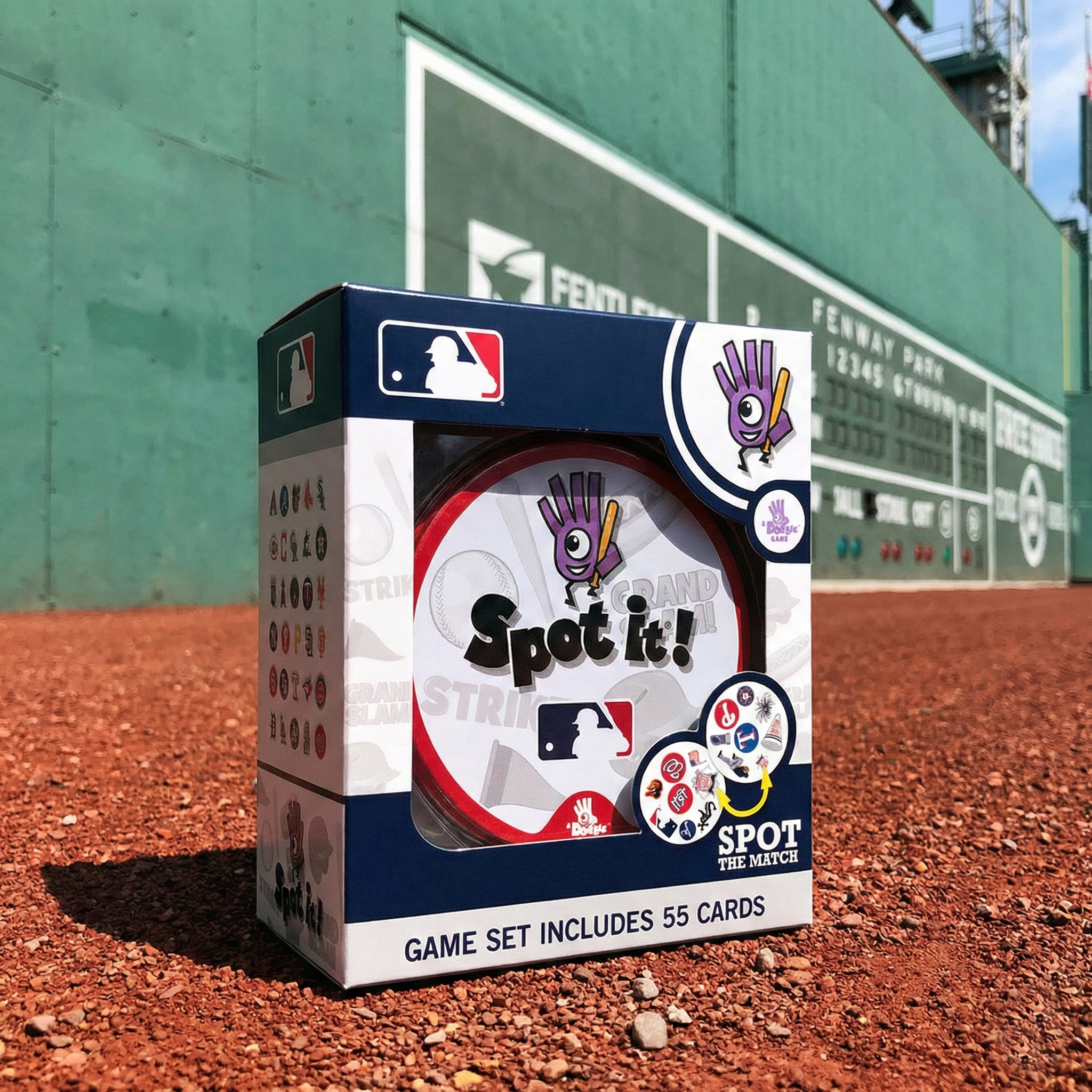 MLB baseball Spot it! game set box packaging on the outfield dirt at Fenway Park