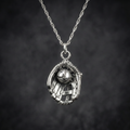 sterling silver baseball glove necklace on cool black background
