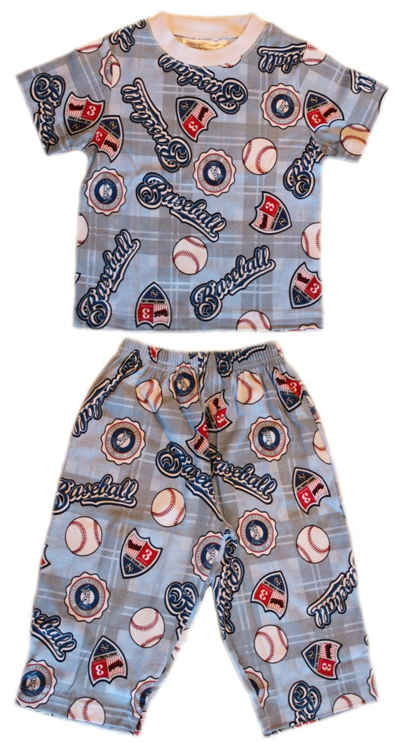 Children's pajama set with baseball-themed pattern on a white background