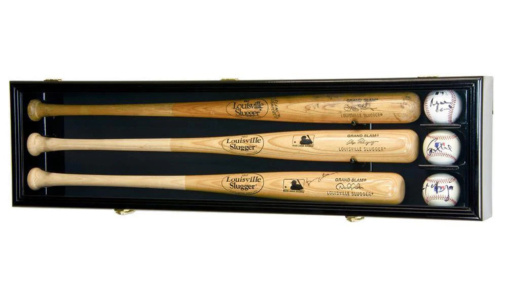 Set of three Louisville Slugger baseball bats in a display case with balls on a white background