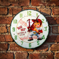 Vintage-style clock with a baseball player Big Hit Bubble Gum design on a brick wall.