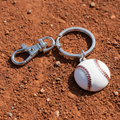 Baseball keychain on a dirt surface