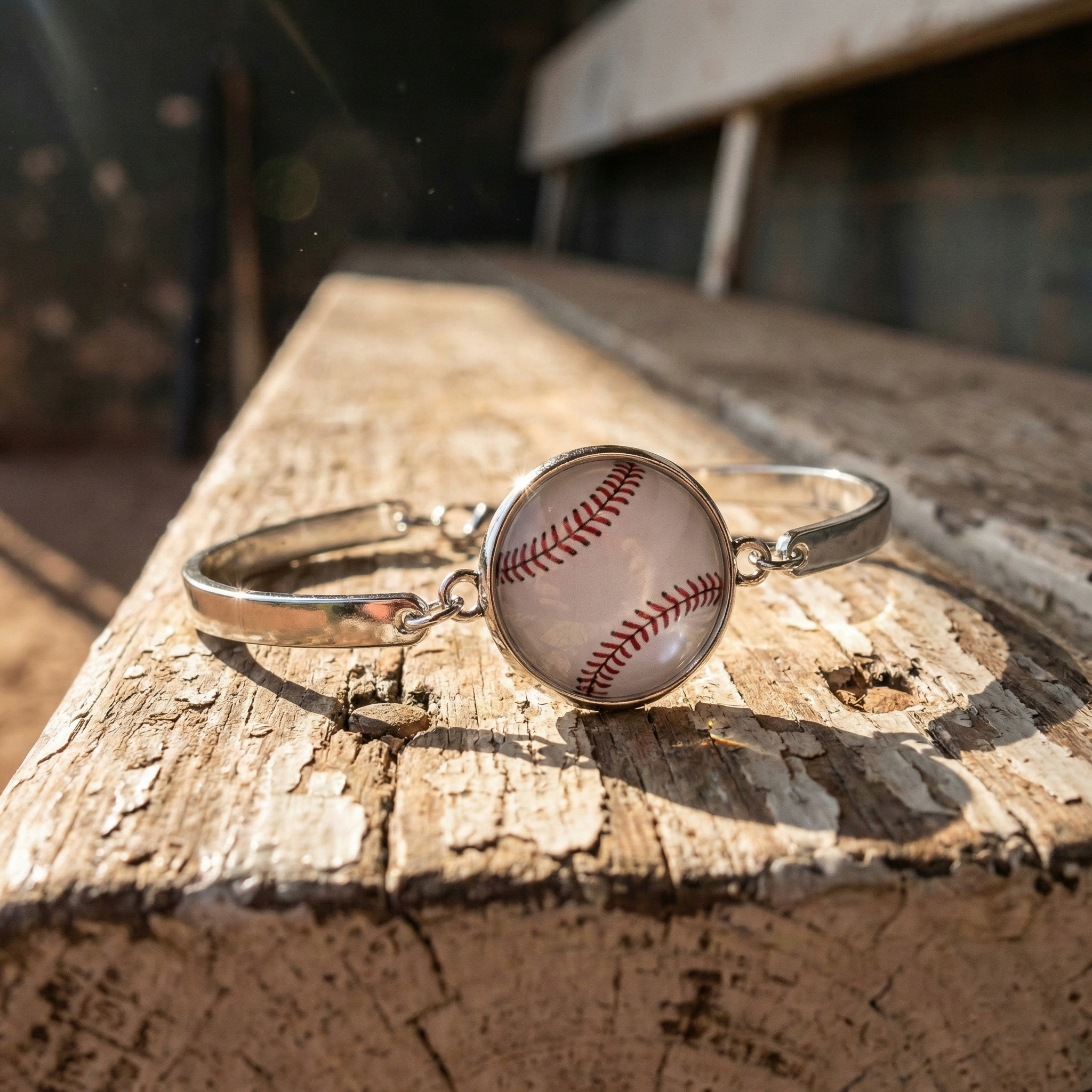 White Baseball Silver Bracelet displayed on a wooden bench 
