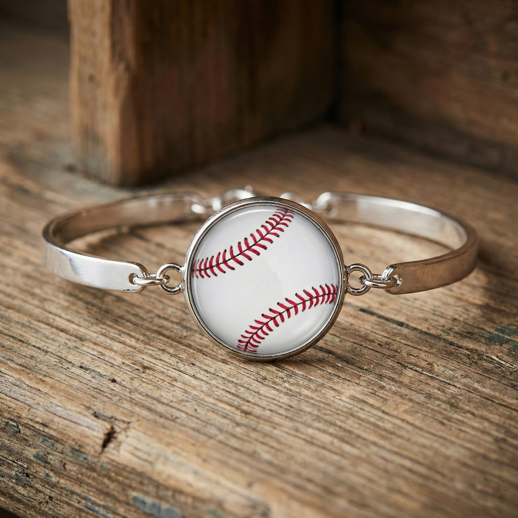 White Baseball Silver Bracelet displayed on wood