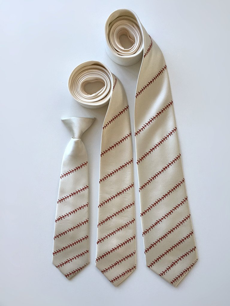 Beige necktie with red pattern on a white background