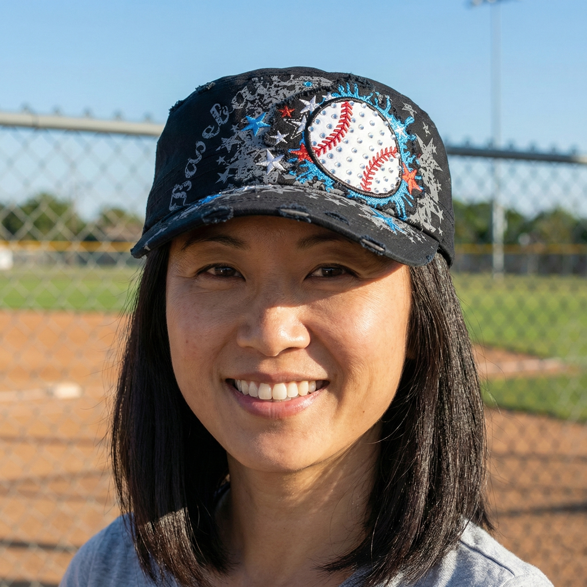black baseball splash rhinestone cadet style cap on a woman at the local baseball field
