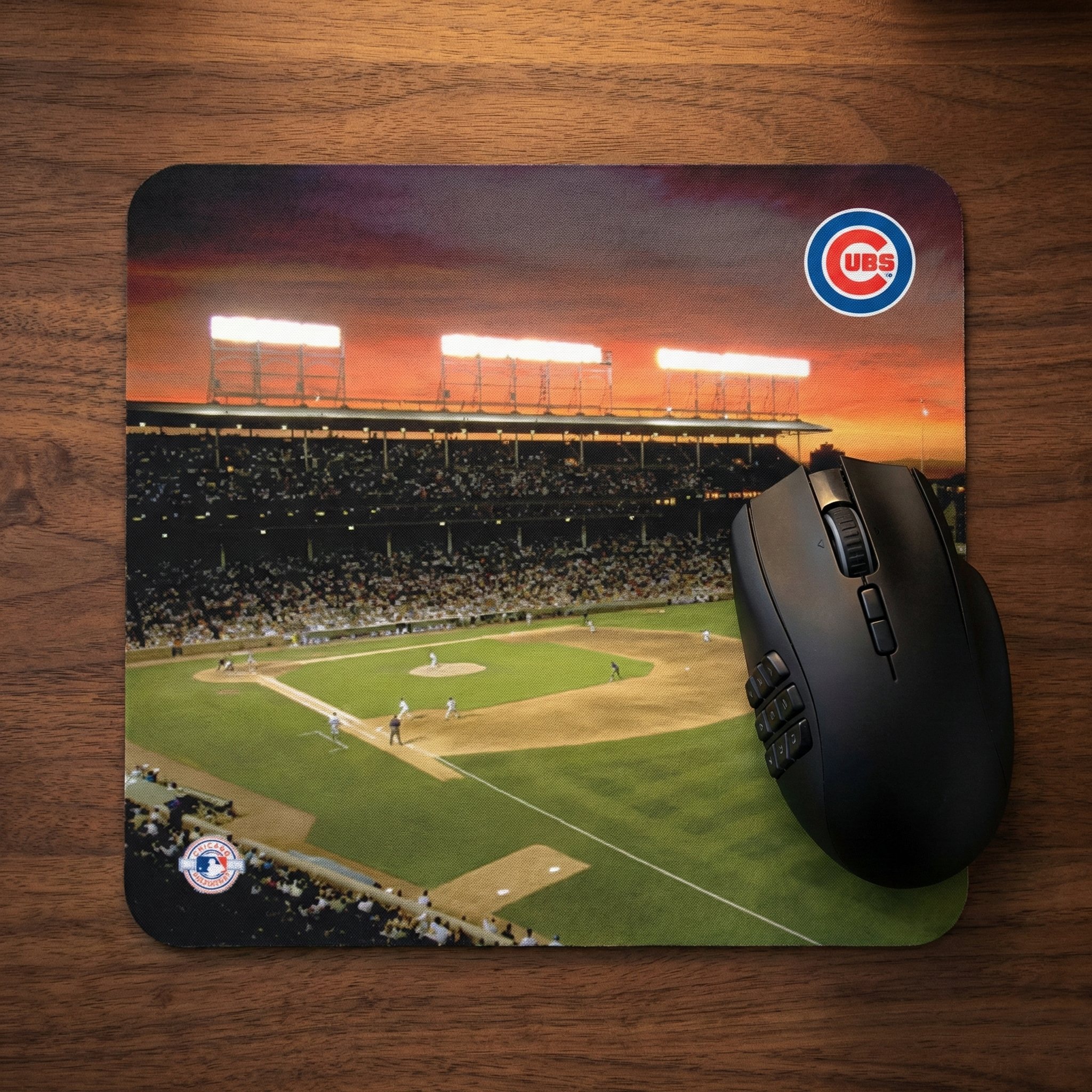 Mouse pad with Chicago Cubs Wrigley Field baseball stadium design and a mouse on a wooden surface
