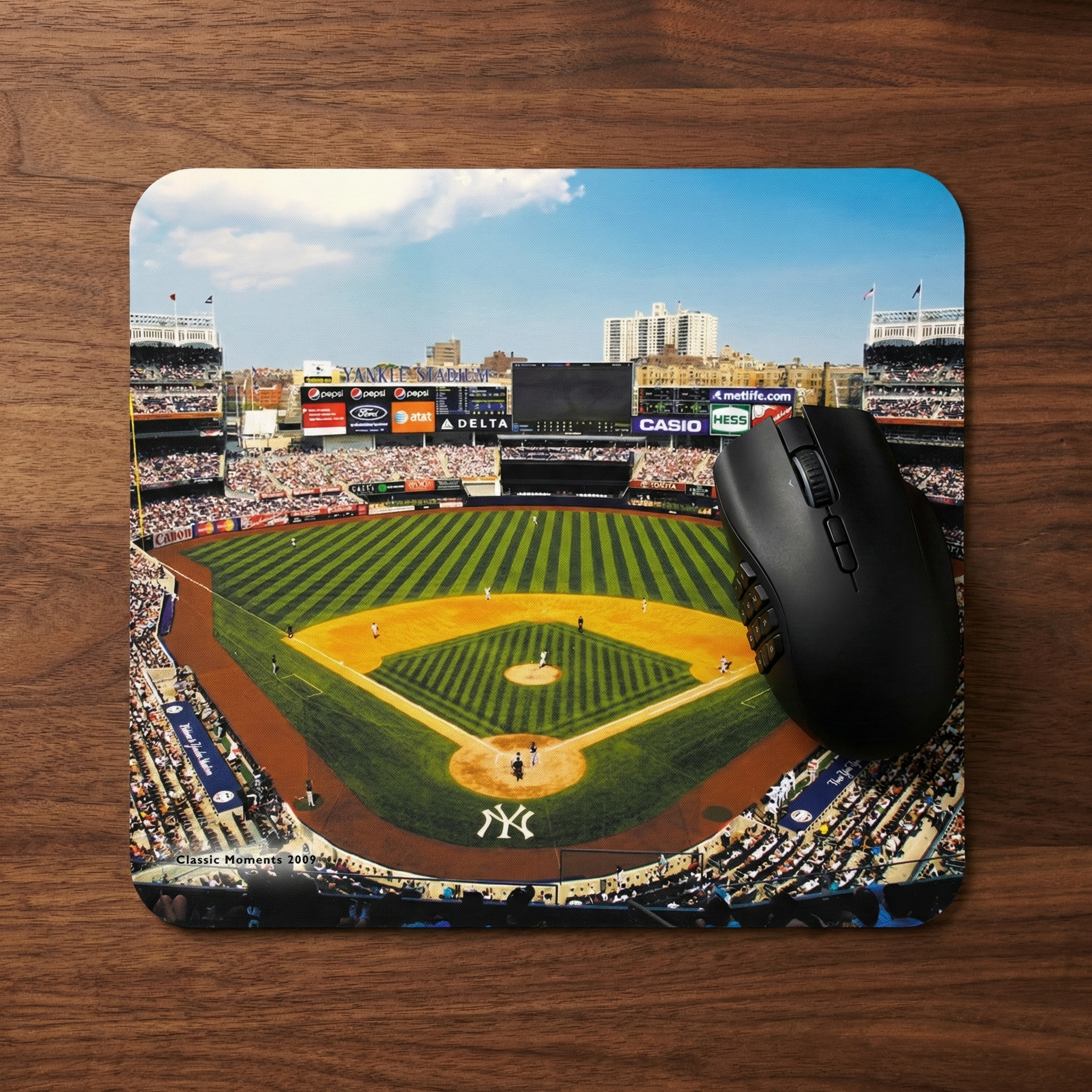 New York Yankees baseball Yankee Stadium mouse pad with a black mouse on a wooden surface